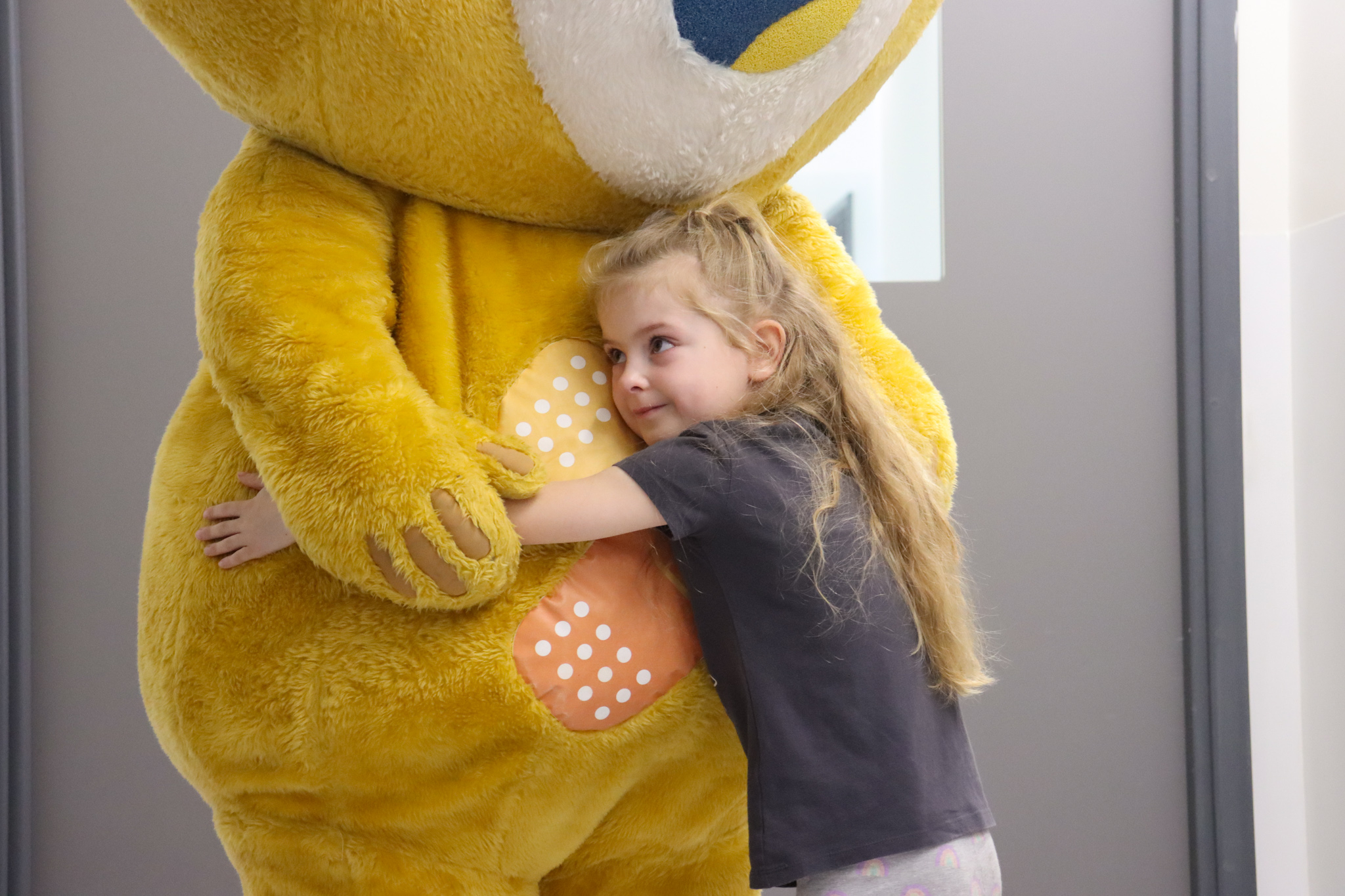 JFP Childrens Hospital - little girl hugging charity mascot.jpg